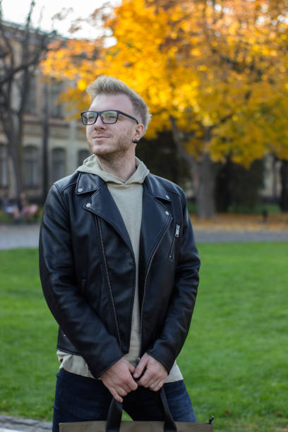 istock Happy smart smiling guy in casual clothes looking to the right 1064643442