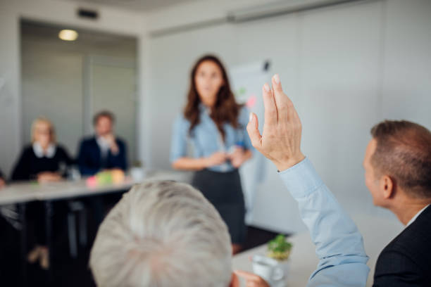 istock Business person raising hand 1064651188