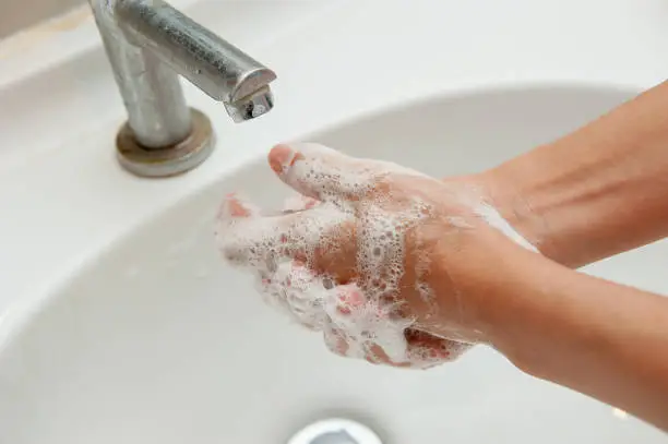 Photo of washing his hands