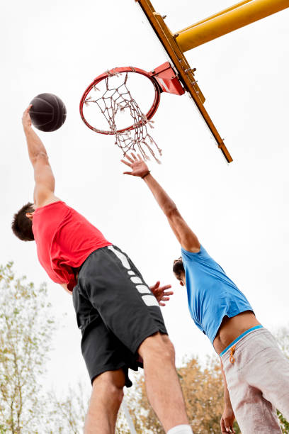 istock Friends playing basketball 1064658256