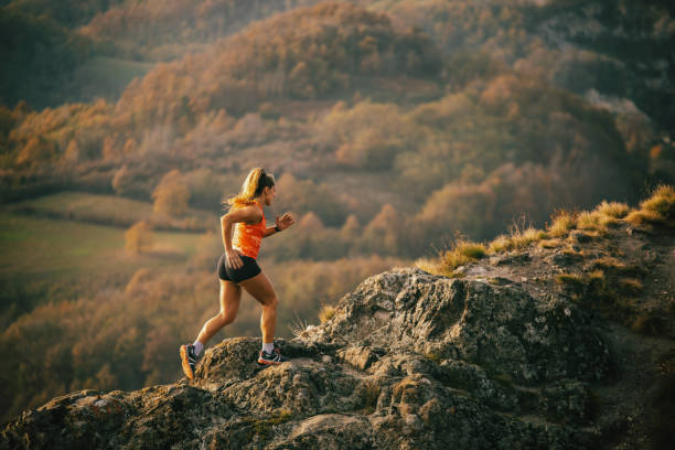 istock Young woman running on mountain 1064658614