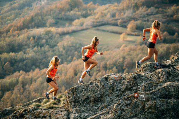 istock Young woman running on mountain 1064658726