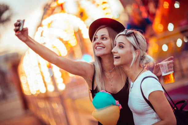 istock Friends in amusement park 1064661818