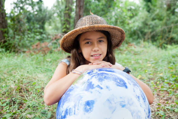 istock Girl hugging the world 1064665964