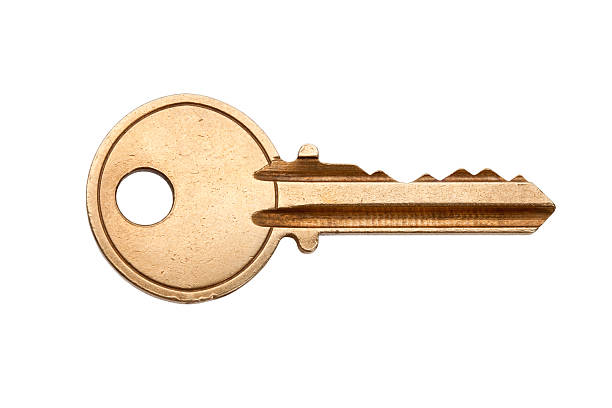 A blank brass key against a white background Golden House Key with white background key photos stock pictures, royalty-free photos & images