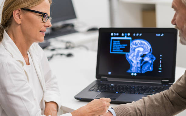 istock Female Doctor Explaining Brain X-Ray To Patient 1064670398