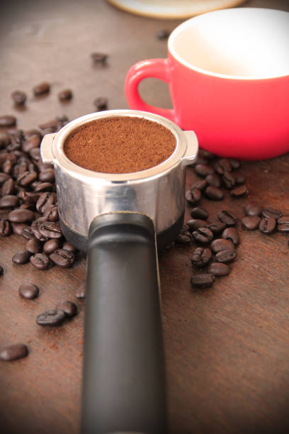istock making freshly ground morning coffee with a portafilter 1064674430