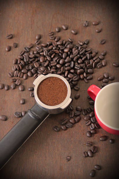 istock making freshly ground morning coffee with a portafilter 1064674604