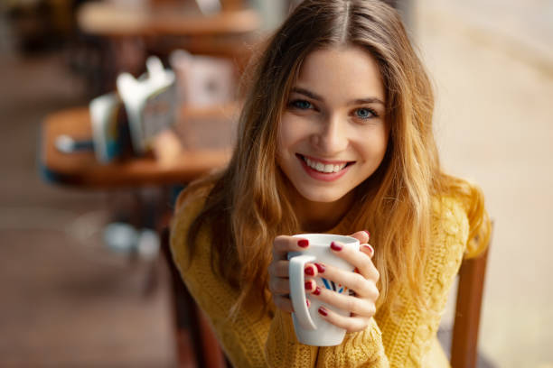 istock Young charming woman having coffee in a coffee shop 1064679006