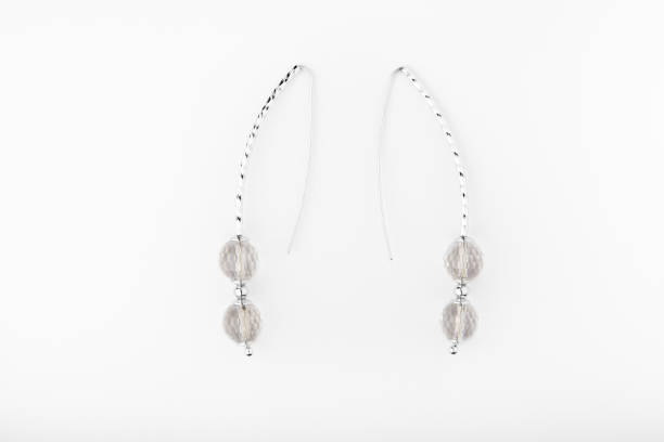 istock silver earrings rhinestone white background 1064679506
