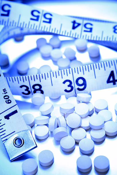 istock Pills and tape measure 106468538