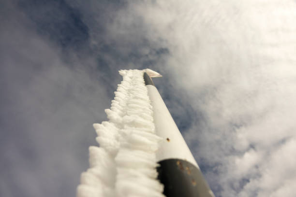 Frozen signs in the mountainsagainst blue sky, in winter