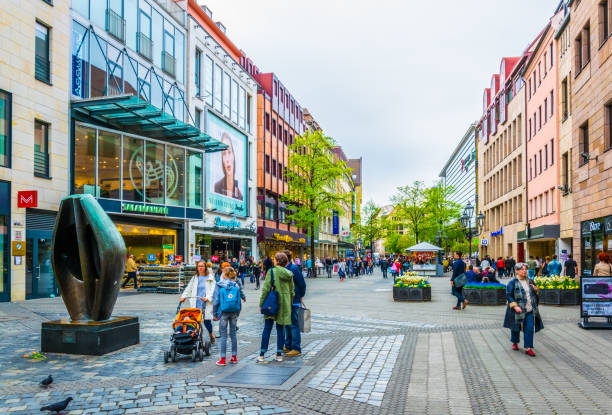 Karolinenstrasse in Nurnberg, Germany. Nurnberg, Germany, April 12, 2017: People are walking on Karolinenstrasse towards saint lorenz cathedral in Nurnberg, Germany. karolinenstrasse stock pictures, royalty-free photos & images