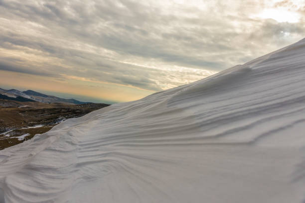An elevated shot of a snowdrift looks a lot like a snowy mountain