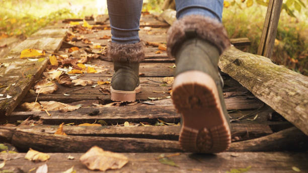 istock Female feet on mountain bridge 1064688314