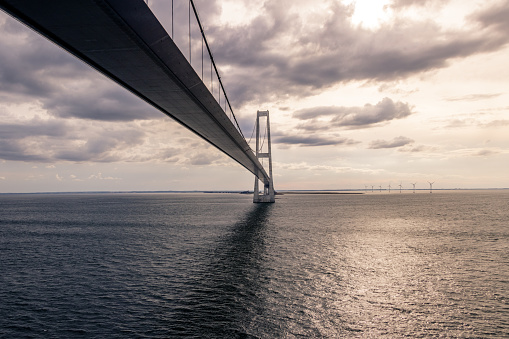 Big Belt Bridge from Funen to Sealand on a cloudy tranquil afternoon.Taken from the Color Line Fantasy which is a cruise ferry between Kiel and Oslo.