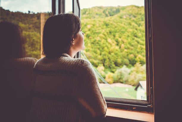 istock Woman in mountain cabin 1064688550