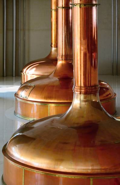 View of beer brewery interior with traditional fermenting copper vats. stock photo