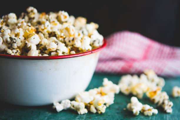 Making Healthy Popcorn At Home Homemade popcorn filled with spices and grains. Perfect snack for movie days at home. yeast stock pictures, royalty-free photos & images