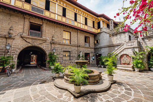 Manila, Philippines, May 3rd 2018: Public area towards Entrance of Casa Manila, typical spanish colonial Old Town Intramuros Courtyard Patio with Fountain - Watery at Plaza of Casa Manila in famous Intramuros Area, Manila, Luzon, Philippines, South East Asia