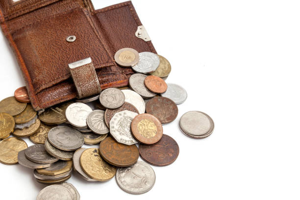 istock Old brown purse with different coins 1064703898