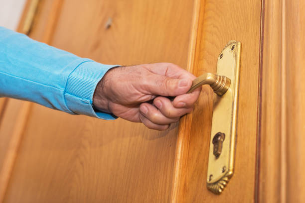 istock Man hand open door knob 1064715284