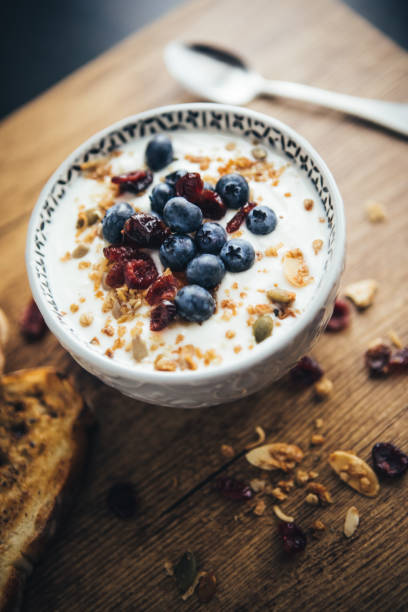 istock Healthy Breakfast, Yogurt, Granola And Toasts 1064716116