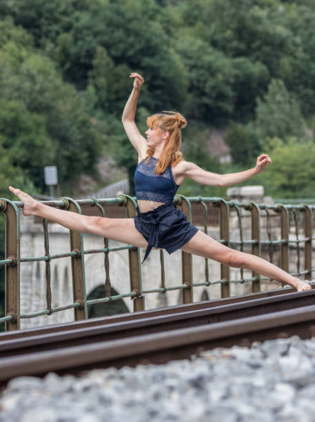 istock Ballet dancer performance in the city on a bridge 1064716682