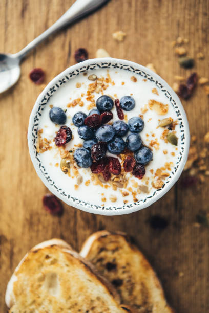 istock Healthy Breakfast, Yogurt, Granola And Toasts 1064716698