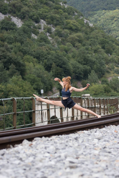 istock Ballet dancer performance in the city on a bridge 1064718538