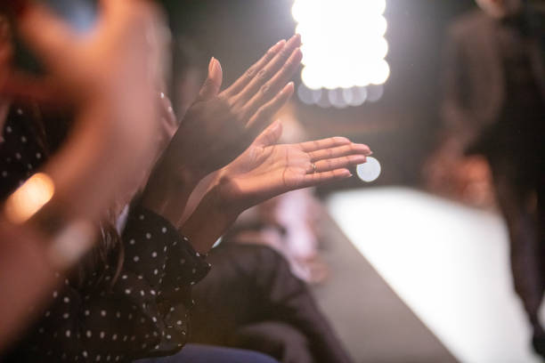 istock Audience applauding at fashion show 1064720472