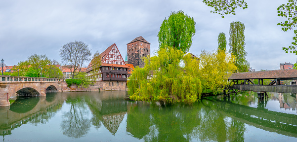 Historical old town with view of Weinstadel, bridge and Henkerturm tower in Nurnberg, Germany.