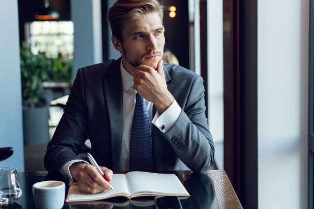 istock Businessman doing his work and having coffee in cafe 1064725180