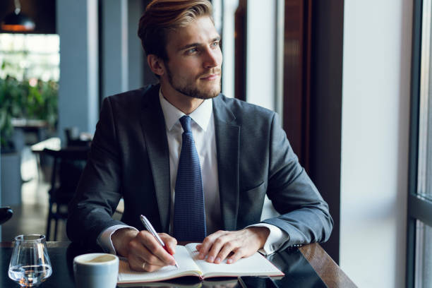 istock Businessman doing his work and having coffee in cafe 1064725182