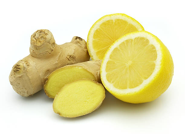 istock Sliced lemons and ginger isolated on a white background 106472577