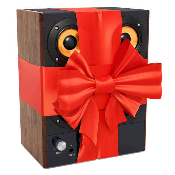istock Musical speakers with ribbon and bow, gift concept. 3D rendering isolated on white background 1064727120