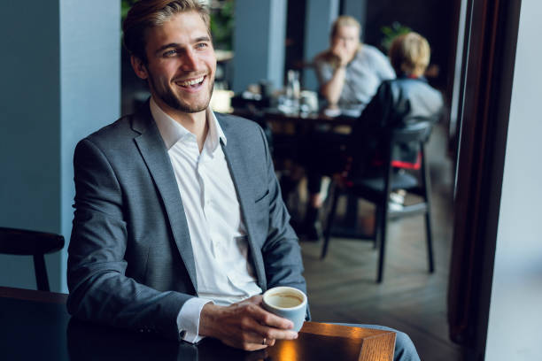 istock Business man drinking coffee in a cafe 1064727138