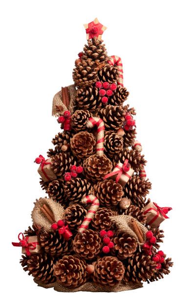 christmas tree made of cones decorated with cinnamon sticks, nutmeg. hand-made. element for christmas and new year design. isolated on white - canella imagens e fotografias de stock