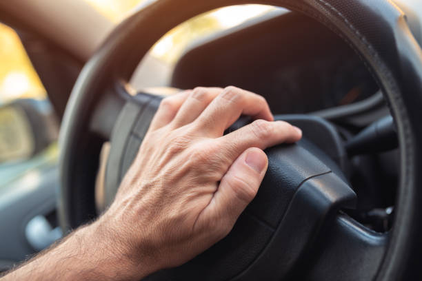 istock Nervous driver pushing car horn 1064727800