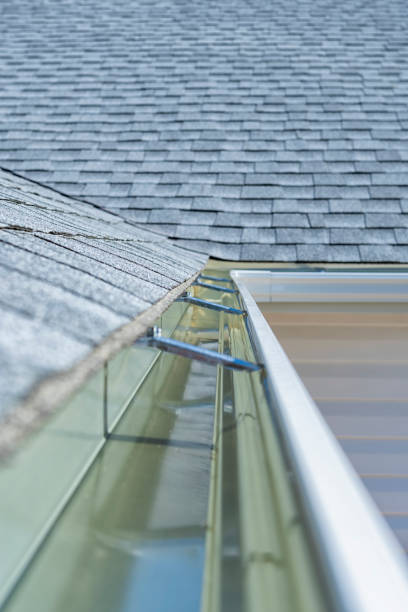 istock Newly installed rain gutters and asphalt shingles on a residential home 1064731136