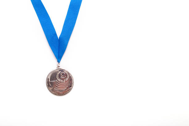 istock Silver medals with blue ribbon on white background. 1064732460