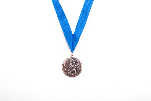 istock Silver medals with blue ribbon on white background. 1064732488