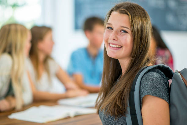istock Smiling young woman in classroom 1064732620