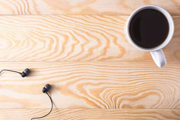 istock coffee and headphones on a wooden background 1064733000