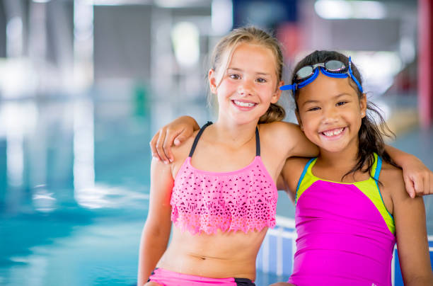 istock Young girls next to pool 1064735882