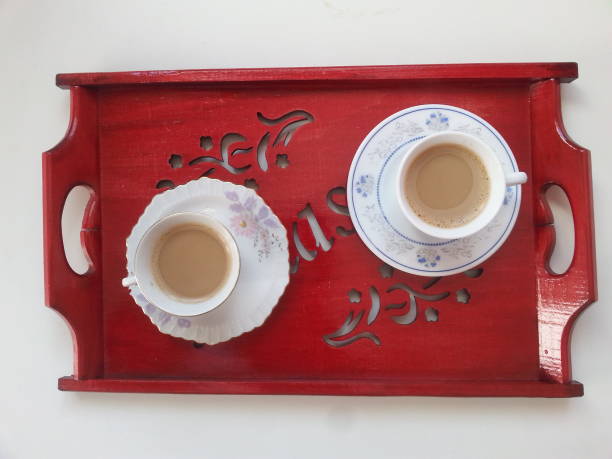 istock red wooden tray and coffee cups 1064736260