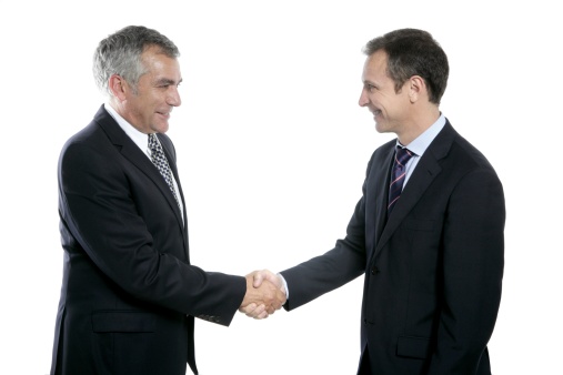 Two workers shake hands. White background.
