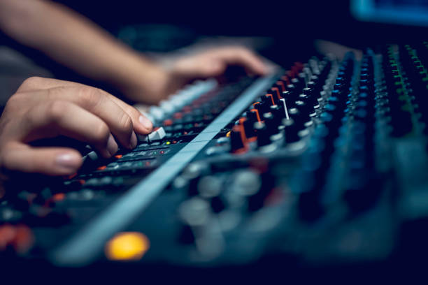 Hand with sound recording studio mixer Young male dj works in modern broadcasting studio stereo photos stock pictures, royalty-free photos & images