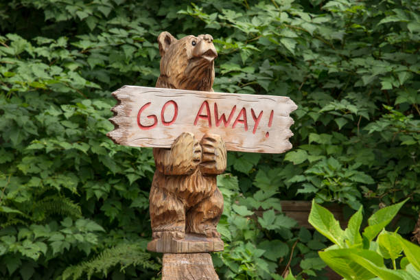 istock Hand carved Go Away sign 1064740244