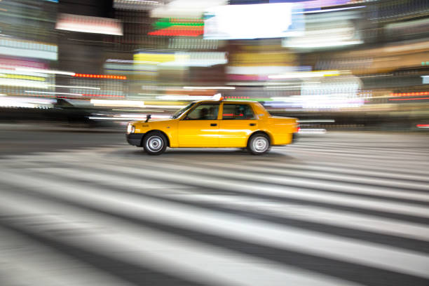 istock Yellow taxi with panning motion at night 1064740358